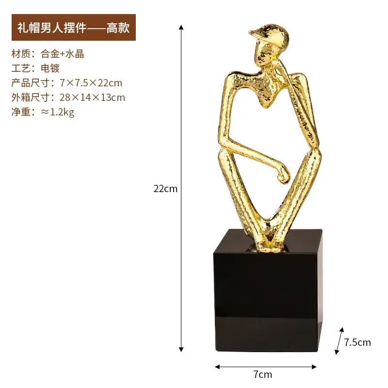 Abstract golden hat thinker figure living room gold & black decor