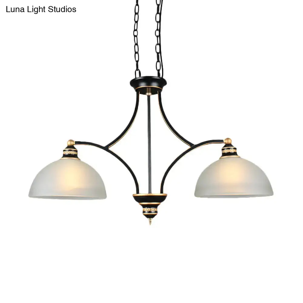 Black and gold dome chandelier with white glass shades dining room