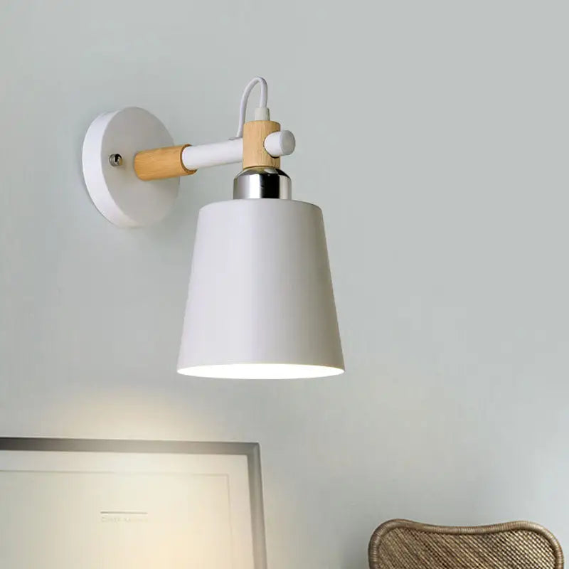 Black matte wall lamp with empire shade and wood arm for stairs