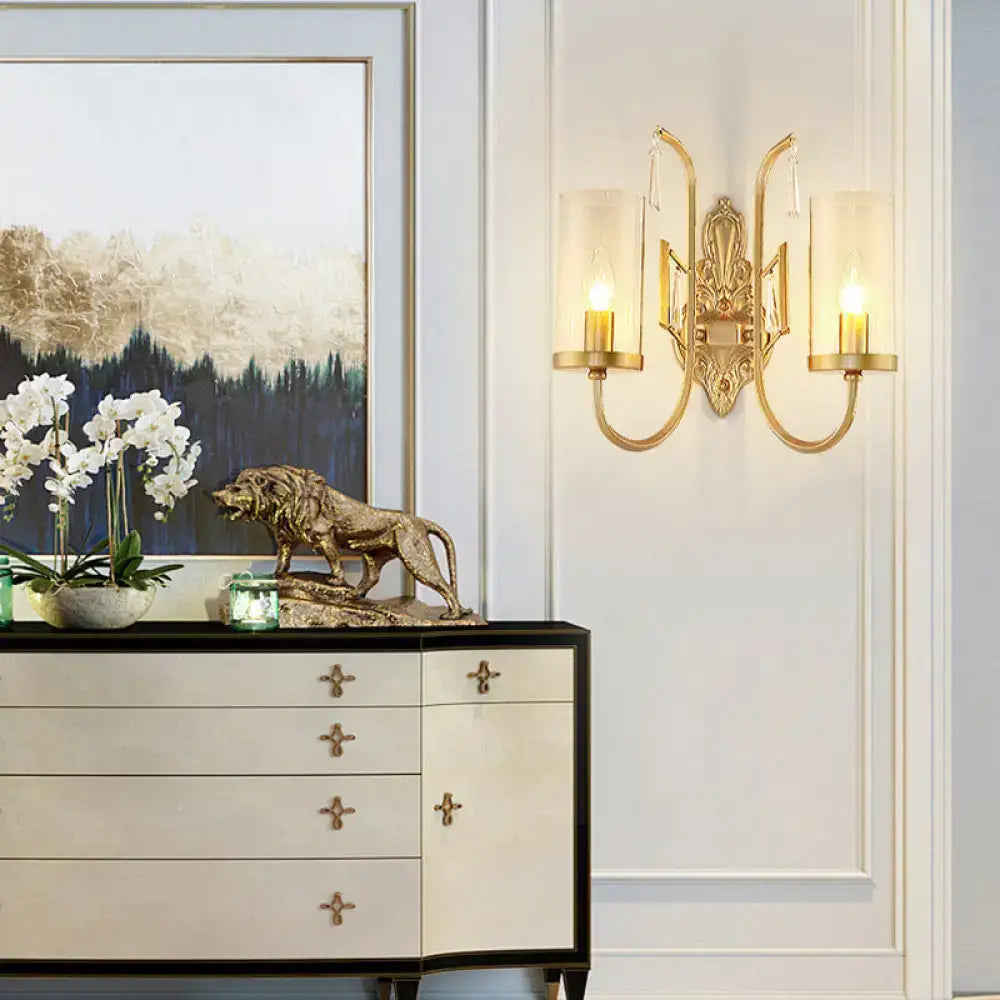 Contemporary gold wall light bedroom sconce with clear glass shade
