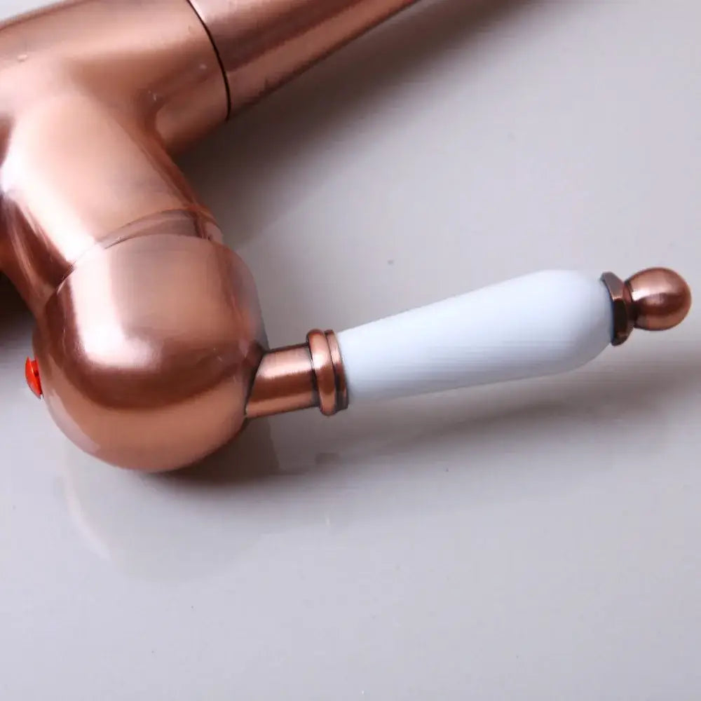 Antique copper and white kitchen basin mixer tap with ceramic handle