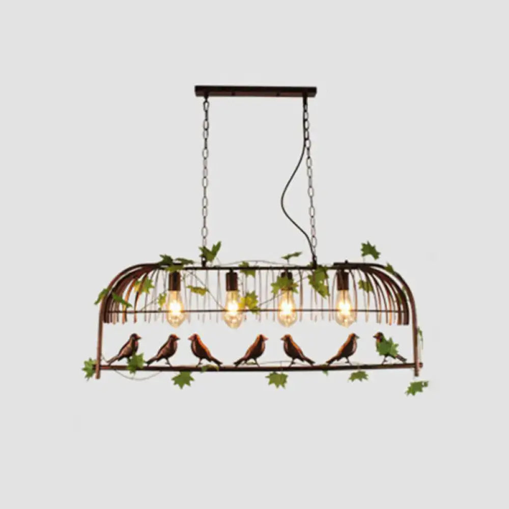Rustic black birdcage pendant light dining room with vine and birds