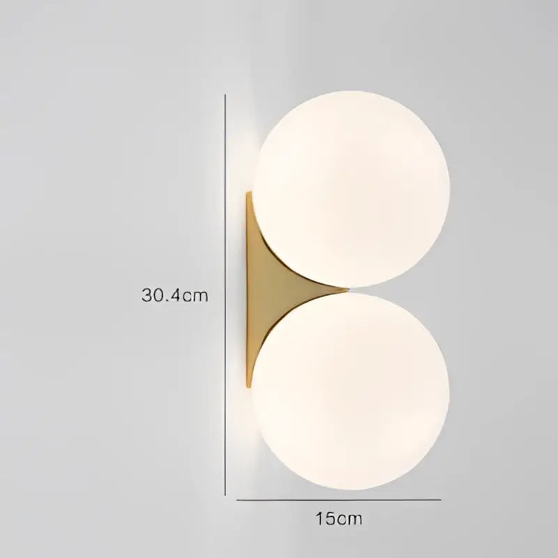 Minimalist brass and glass ball art wall lamp for bedroom