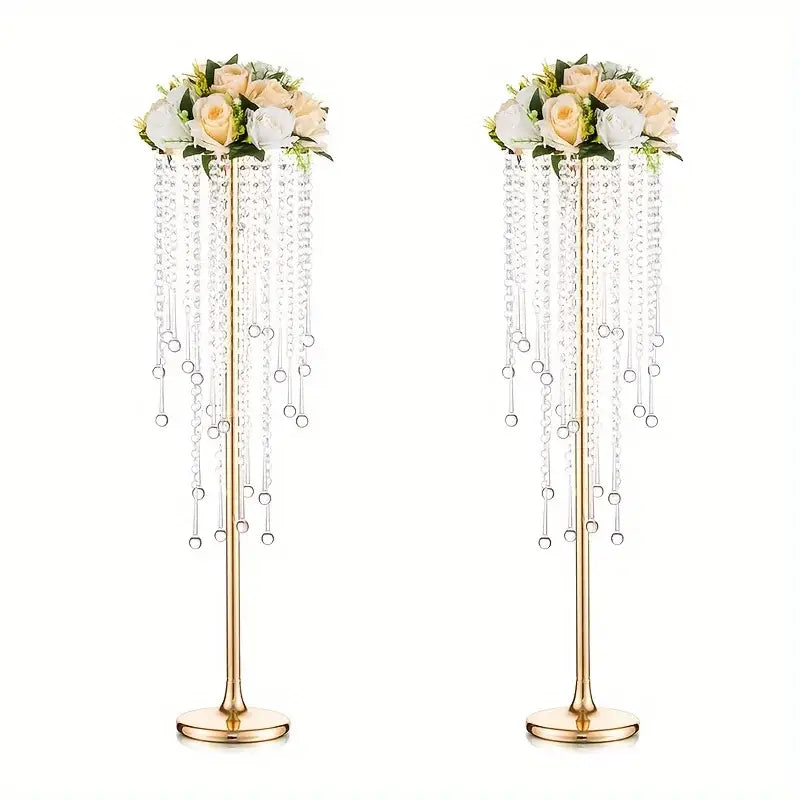 Elegant gold metal vases with crystals and roses for dining room