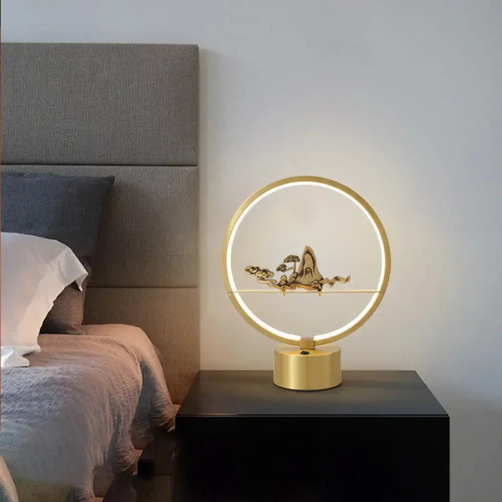 Minimalist gold loop led table light with carved mountain decor bedroom