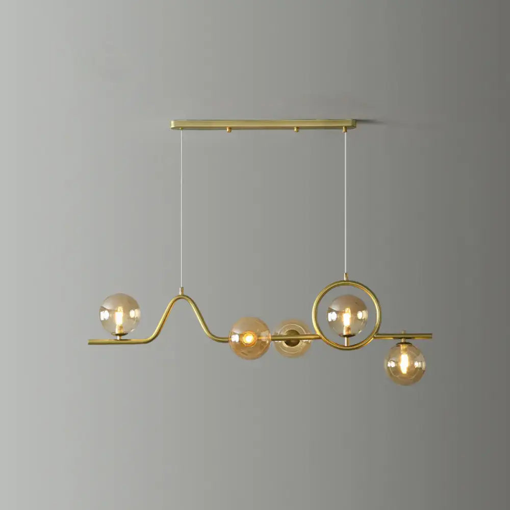 Modern gold curve island ceiling light with bird for dining room