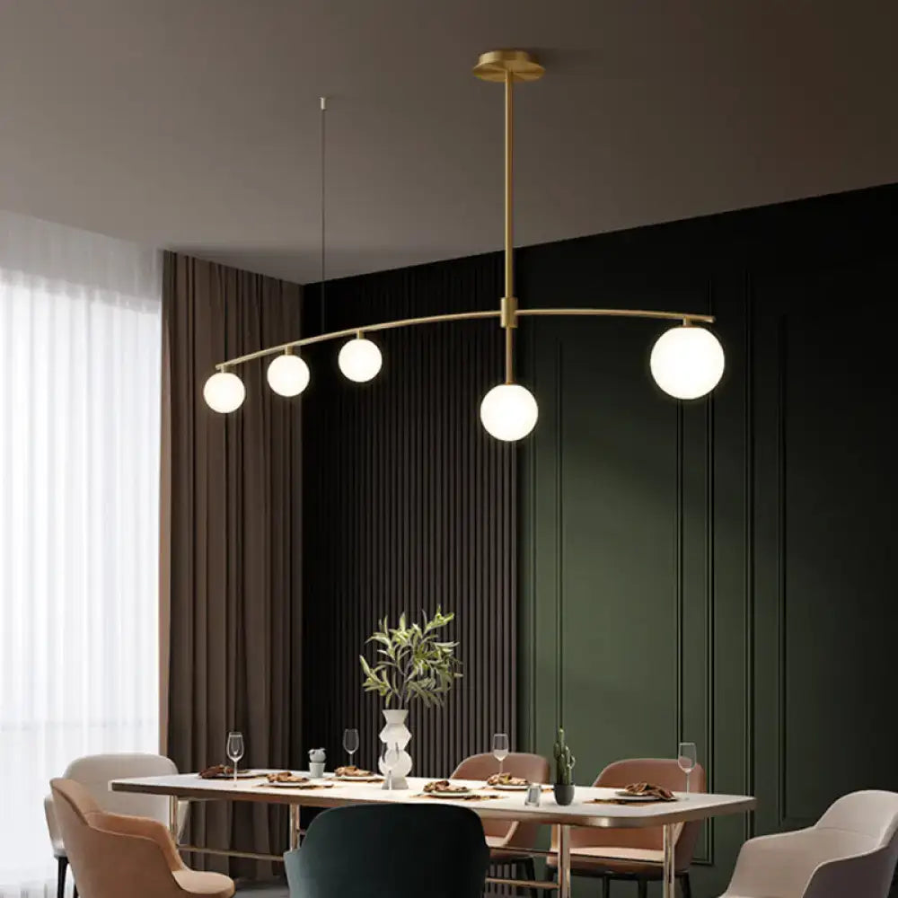 Postmodern gold pendant light with frosted white glass dining room