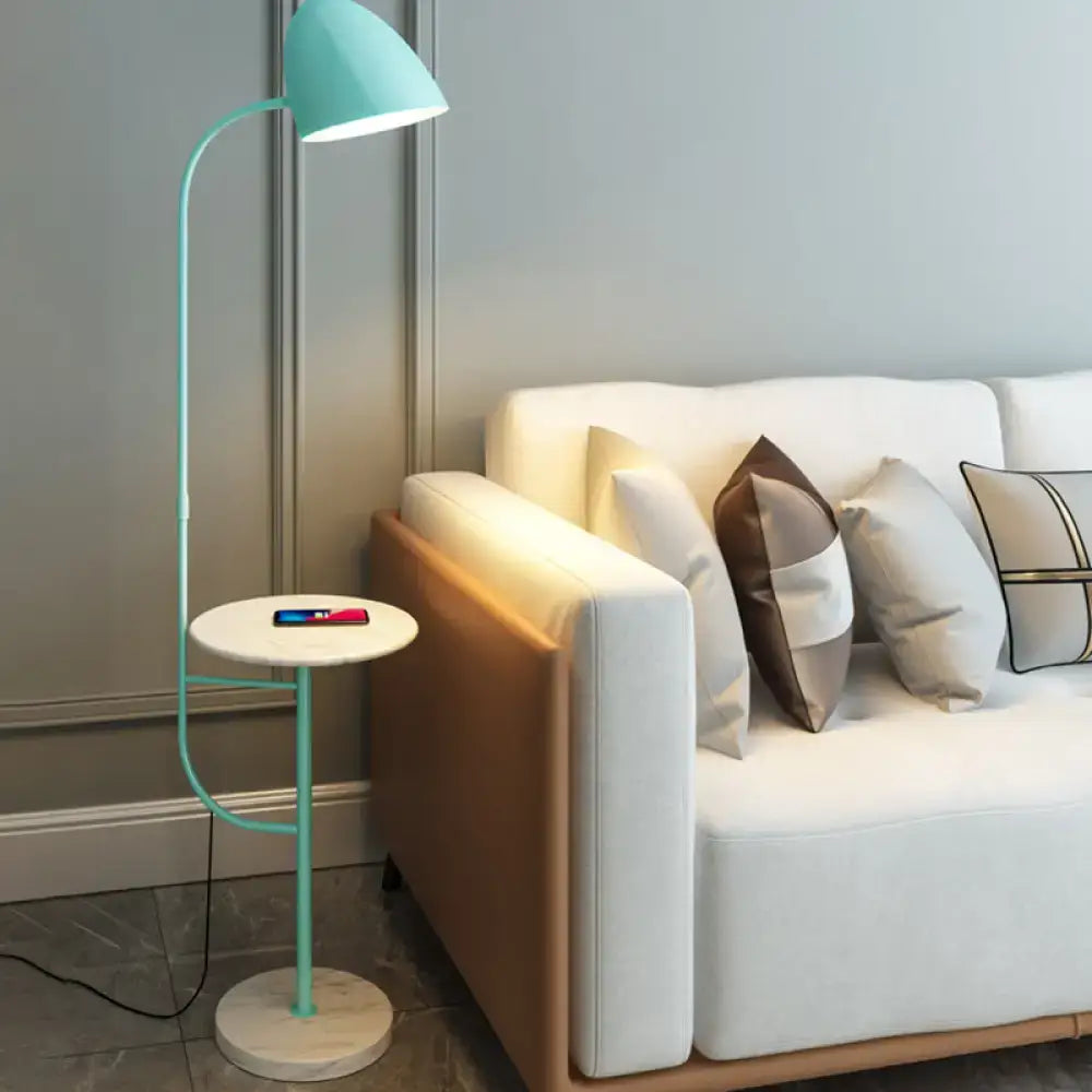 Mint green floor lamp with marble table and wireless charging bedroom