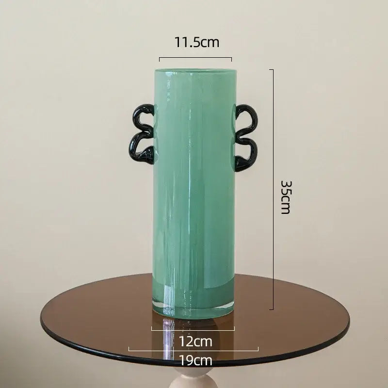 Emerald green glass vase with black handles living room decor