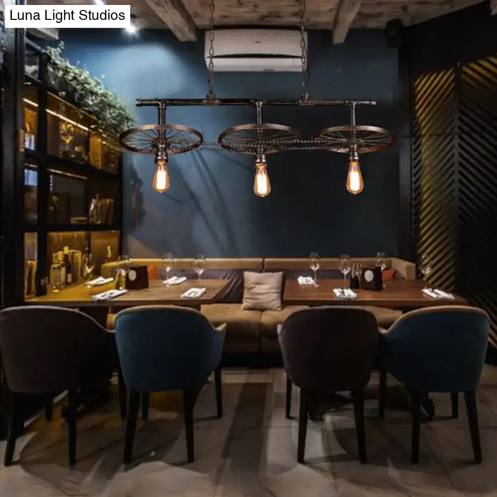 Industrial bronze wheel island pendant light with bare bulbs kitchen