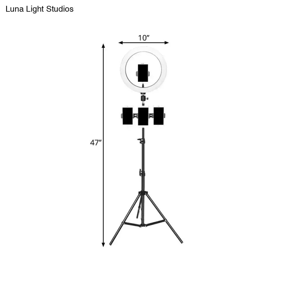 Minimalist black & white mobile phone holder with ring light bedroom