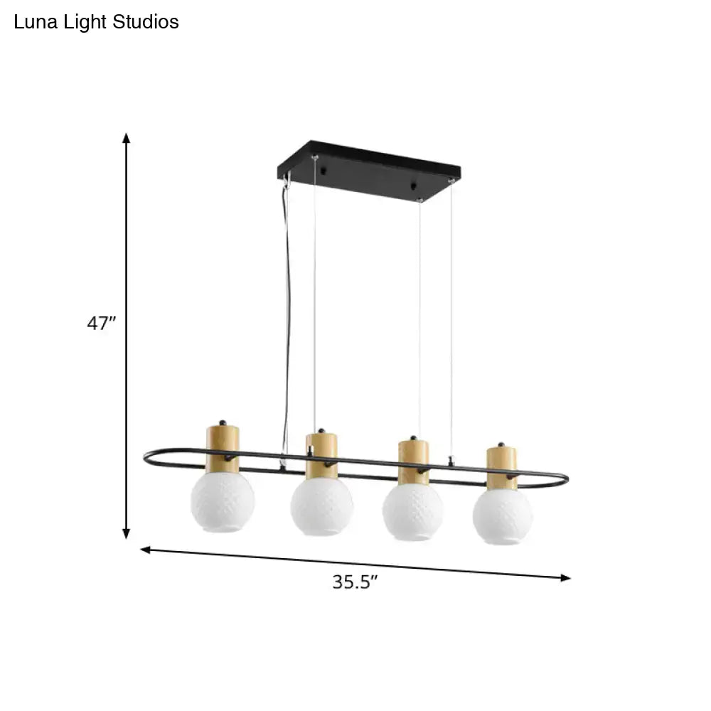 Modern black and wood frosted glass orb pendant light kitchen island