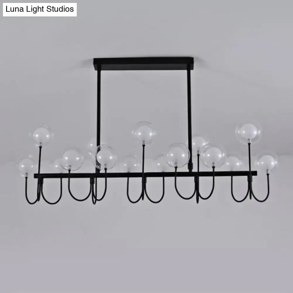 Modern black ceiling light with clear glass globe – dining room