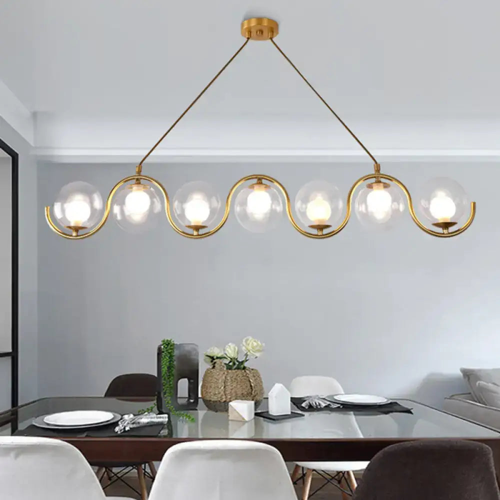 Modern brass and clear glass globe pendant light kitchen fixture
