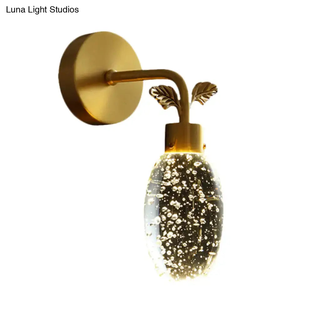 Modern gold leaf led wall sconce with seeded crystal globe bedroom