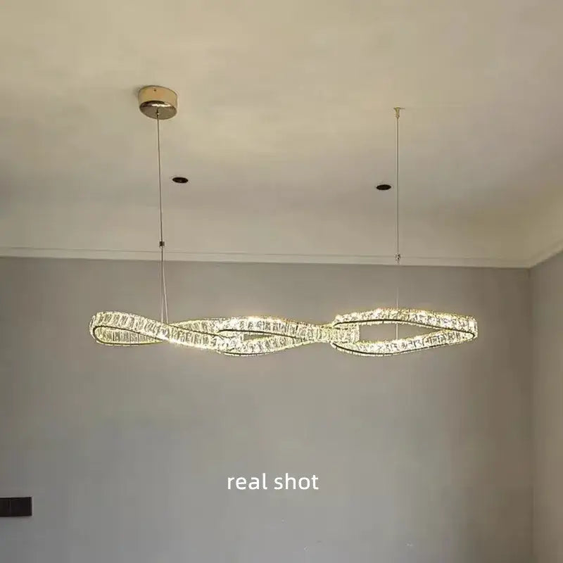 Modern twisted gold metal crystal pendant light for dining room