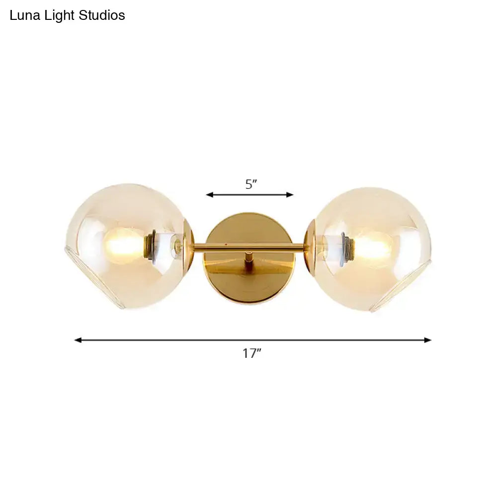 Modernist gold wall lamp with glass shade for living room