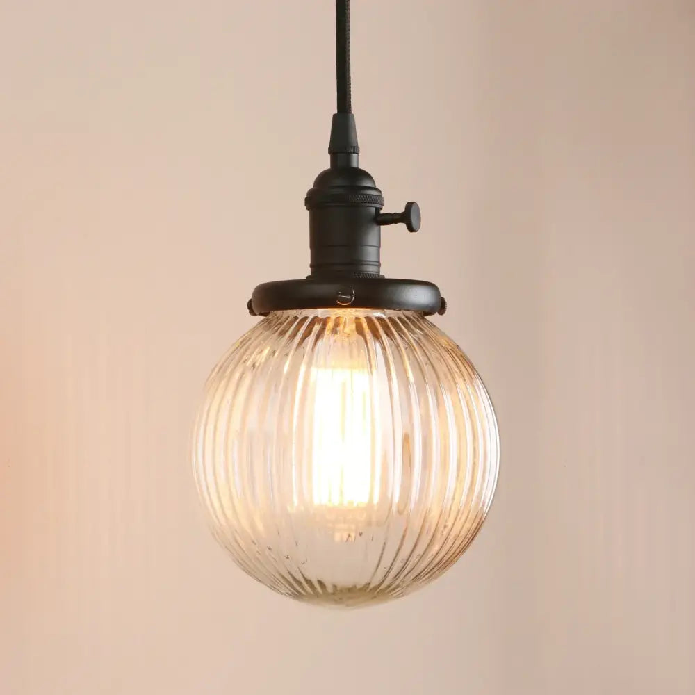 Ribbed glass globe pendant light with brass fixture for living room