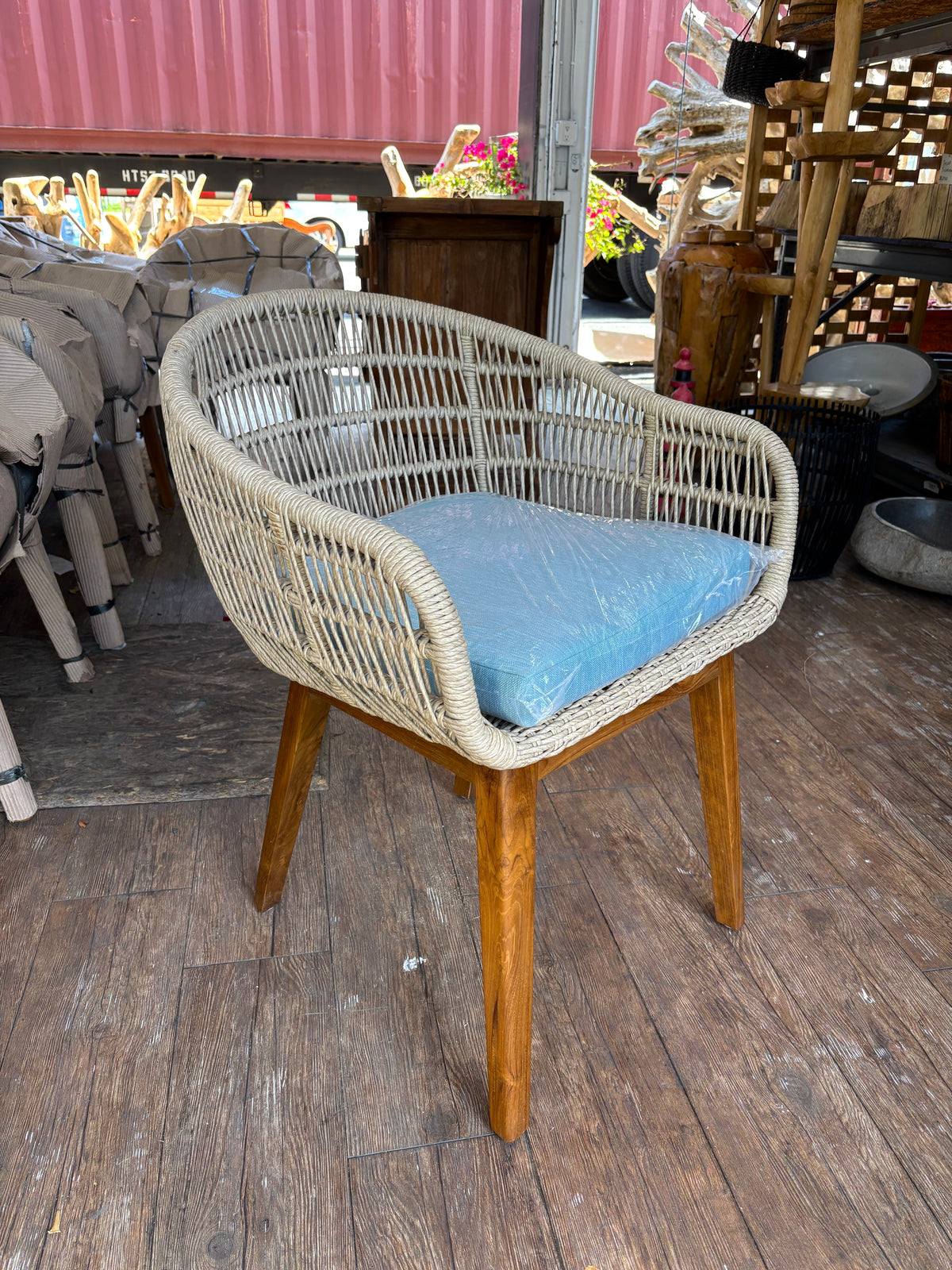 SYNTHETIC ROPE AND TEAK ARM CHAIR W/ BLUE CUSHION