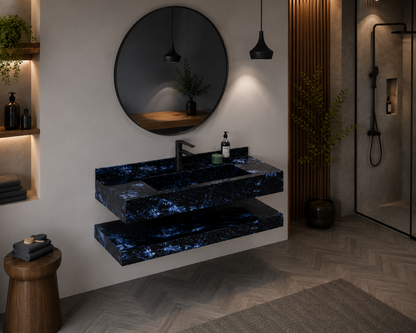 Modern bathroom with a blue marble sink and circular mirror.