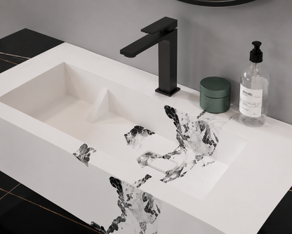 Bathroom sink with black faucet and decorative water feature