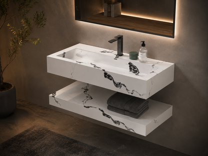 Modern bathroom vanity with sink, faucet, and decorative elements against a neutral wall.