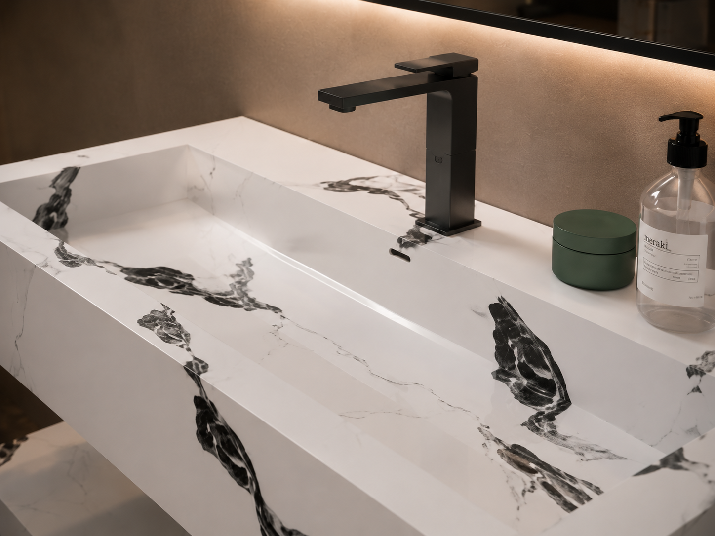Modern bathroom sink with black faucet and decorative elements