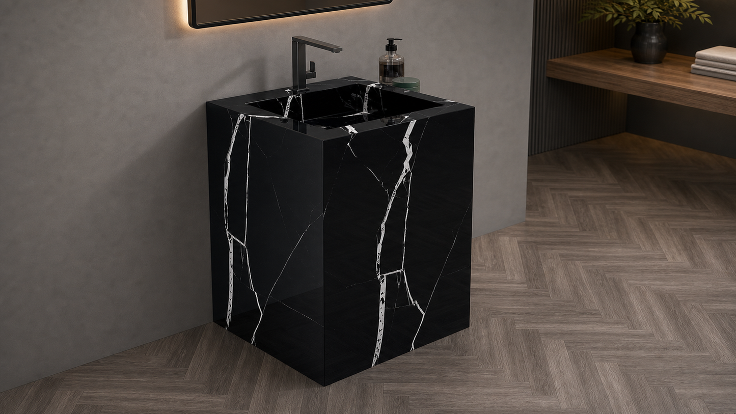 Black marble sink with faucet in a modern bathroom setting