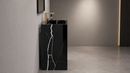 Black marble-patterned freestanding sink in a modern bathroom setting.