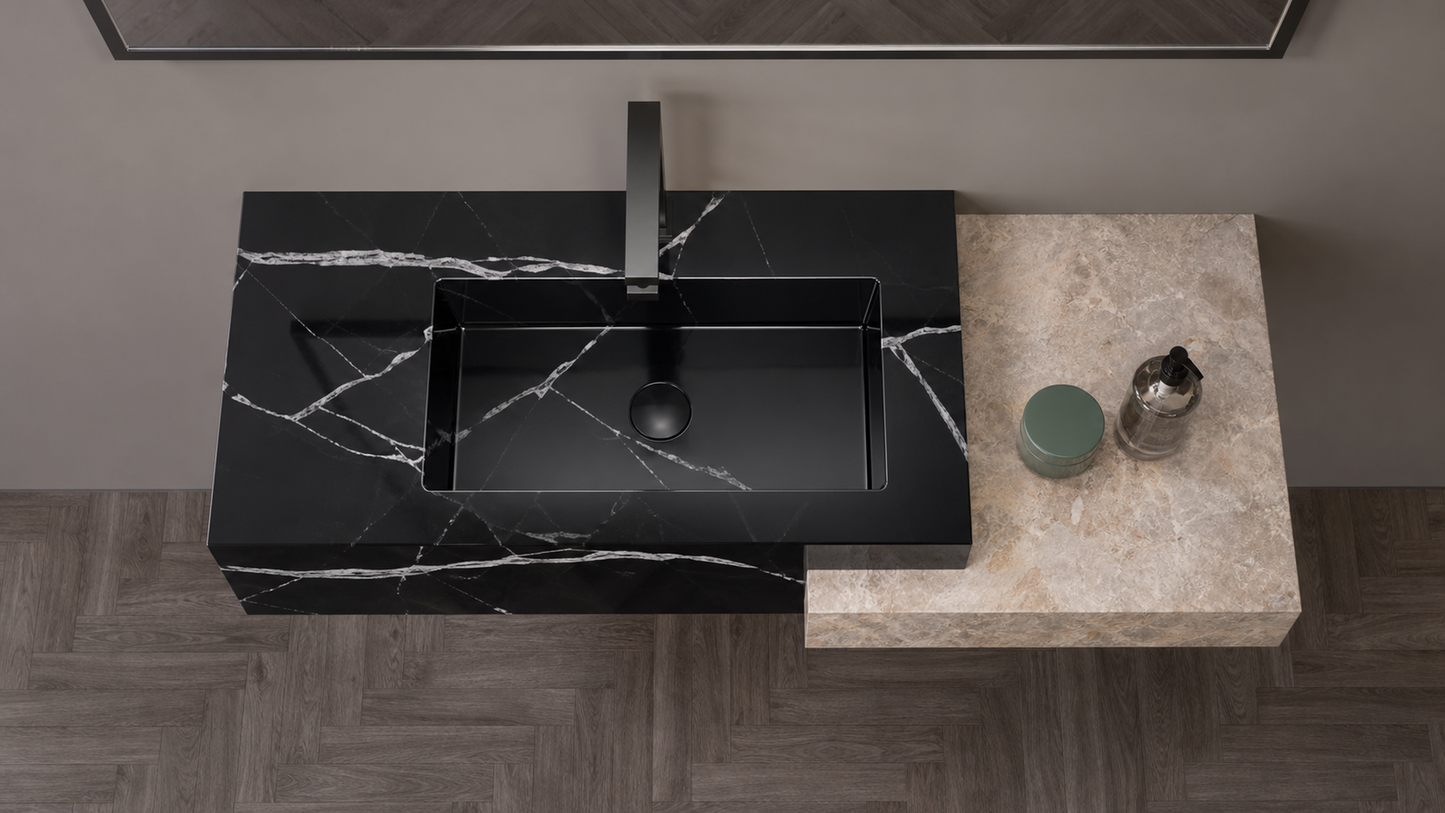 Black marble sink on a stone countertop with a neutral background