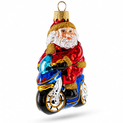 Santa on Motorcycle with Green Backpack Glass Christmas Ornament
