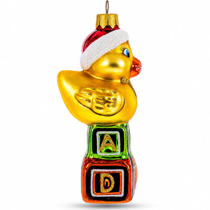 Yellow Duck in Santa Hat on Letter Blocks Glass Christmas Ornament