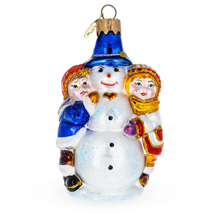 Kids Making Snowman Glass Christmas Ornament
