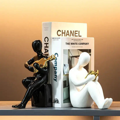 Abstract black and gold character bookends office guitar decor