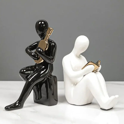 Abstract black and gold character bookends office guitar decor