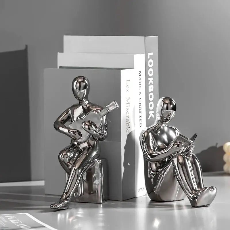Abstract black and gold character bookends office guitar decor