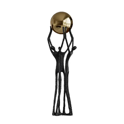 Abstract black and gold human figurine golden ball holder living room
