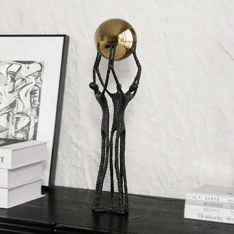 Abstract black and gold human figurine golden ball holder living room