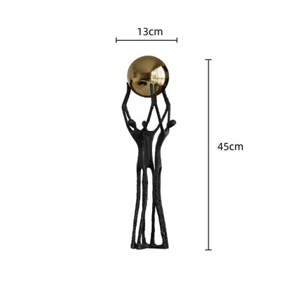 Abstract black and gold human figurine golden ball holder living room