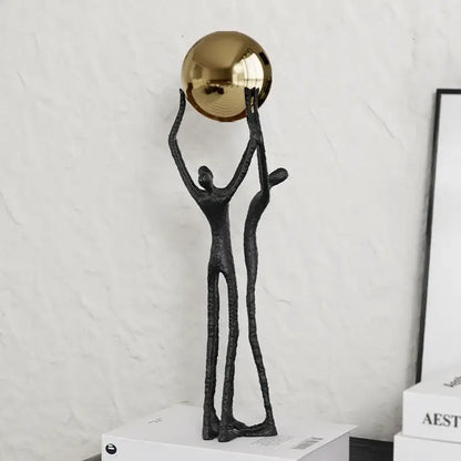 Abstract black and gold human figurine golden ball holder living room