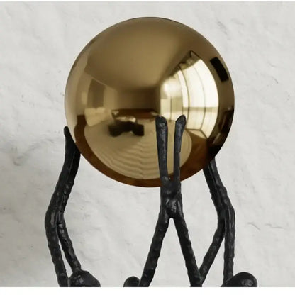 Abstract black and gold human figurine golden ball holder living room