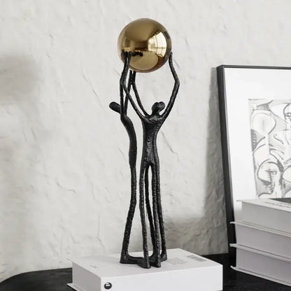 Abstract black and gold human figurine golden ball holder living room