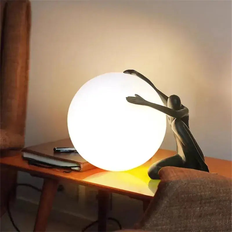 Abstract black & red ball holding character resins lamp living room