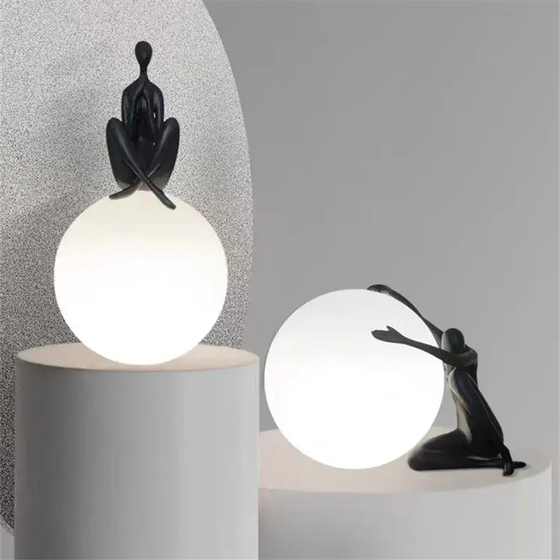 Abstract black & red ball holding character resins lamp living room