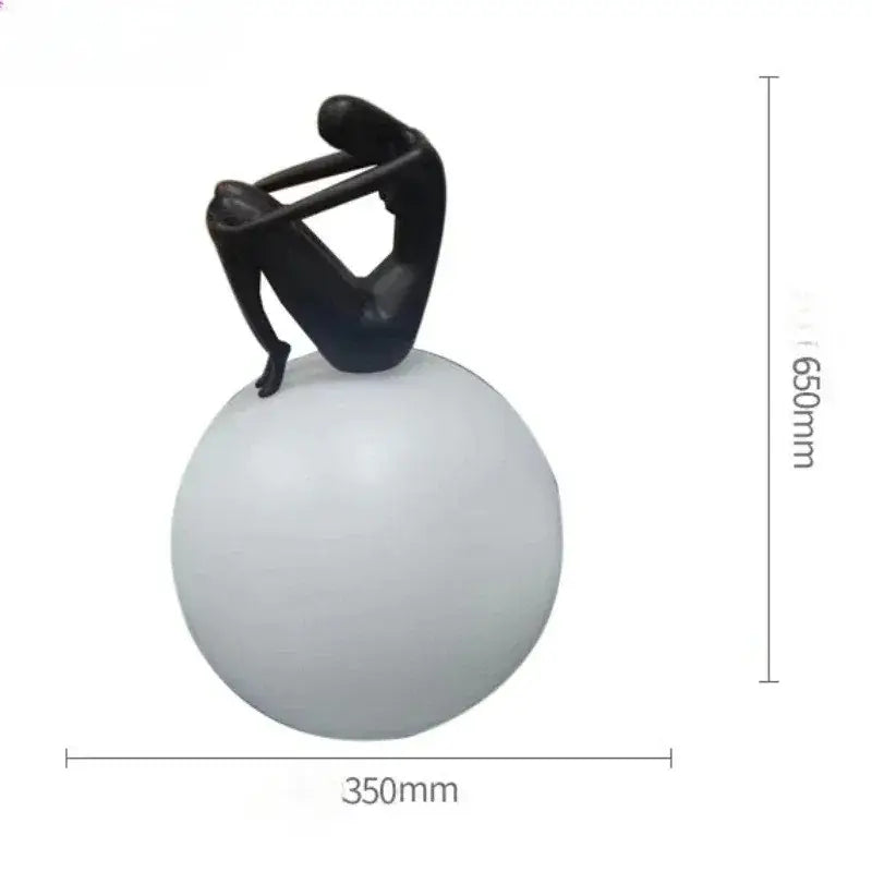 Abstract black & red ball holding character resins lamp living room