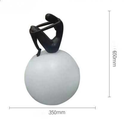 Abstract black & red ball holding character resins lamp living room