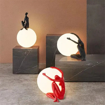 Abstract black & red ball holding character resins lamp living room