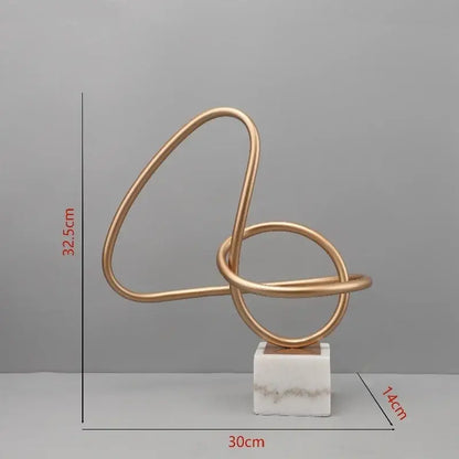 Abstract gold line geometric metal sculptures on marble living room decor