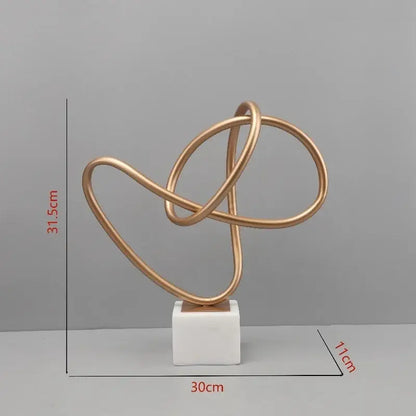 Abstract gold line geometric metal sculptures on marble living room decor