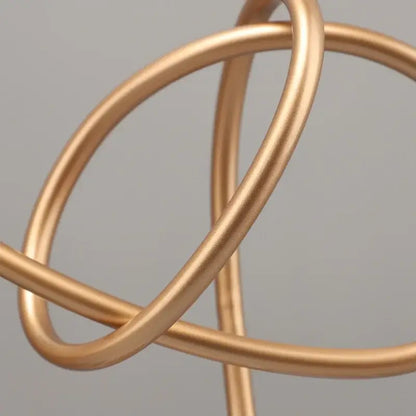 Abstract gold line geometric metal sculptures on marble living room decor